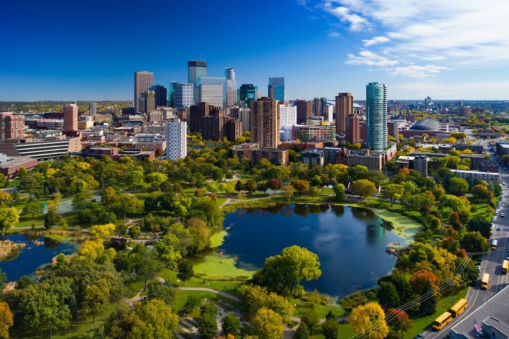 Minneapolis aerial with Downtown Minneapolis skyline in the background and Loring Park with Loring Pond in the foreground, during early autumn. (Minneapolis aerial with Downtown Minneapolis skyline in the background and Loring Park with Loring Pond in