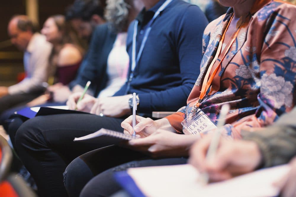 Business people taking notes