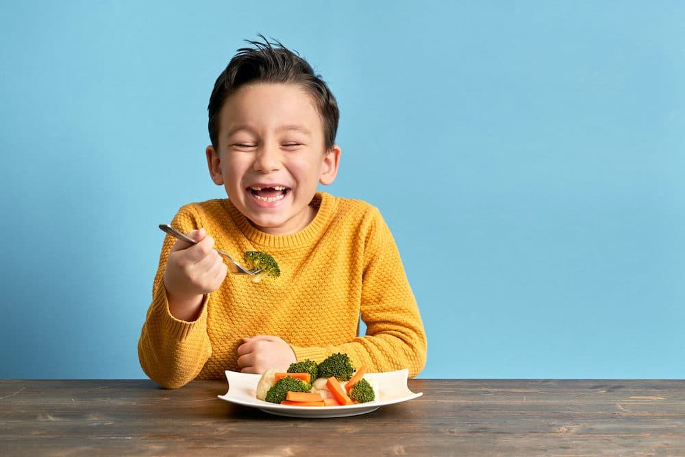 Child is eating vegetables. He is very happy. Image: pinstock/iStock