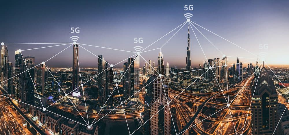 5G Network Wireless Systems and Internet of Things with Modern City Skyline