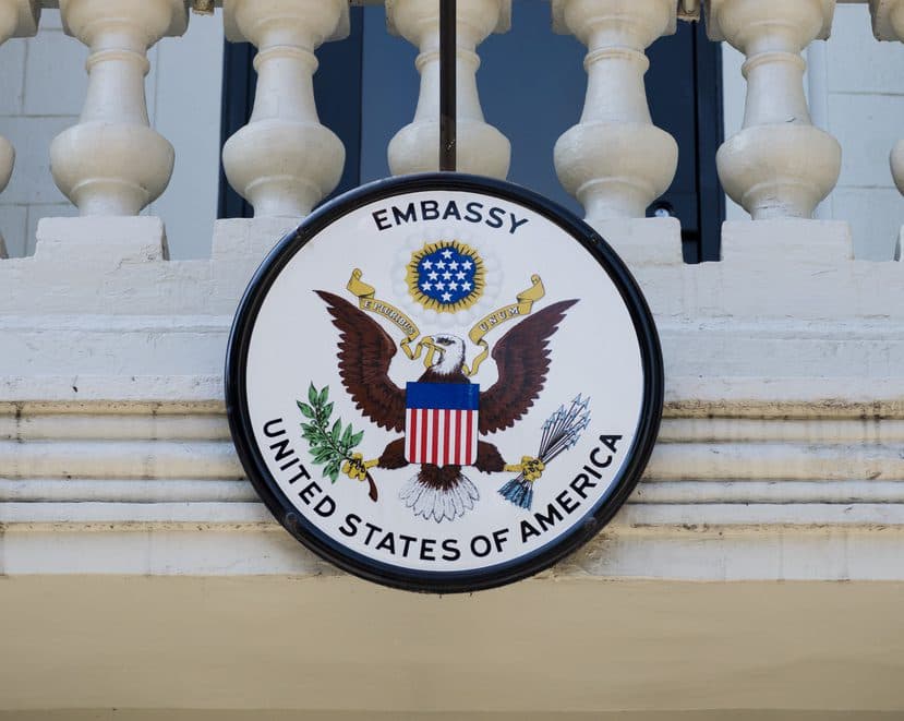 An American flag and U.S. embassy seal hang outside the American embassy in Chisinau, Moldova