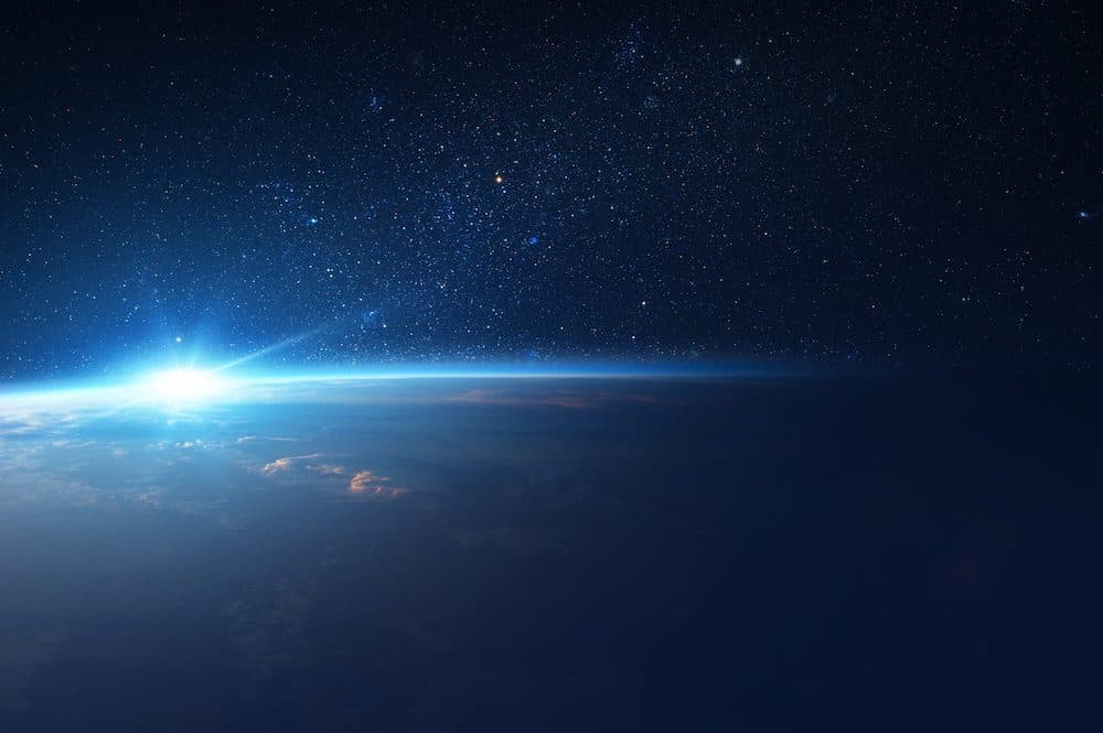 Sun Comes Up from Behind Earth in Space.