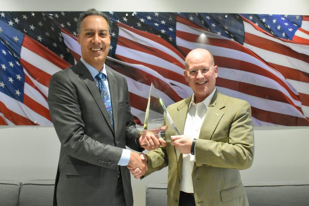 WashingtonExec's JD Kathuria presents SPA's John Burton with a Lifetime Achievement award.