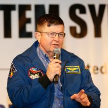 Kenneth Cameron addresses the 2015 K-12 STEM Symposium on his experience as a NASA astronaut