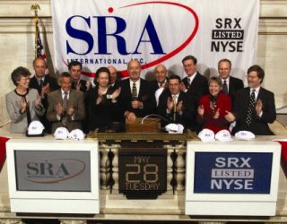 Dr. Ernst Volgenau rings the opening bell of the New York Stock Exchange of SRA's initial public offering.
