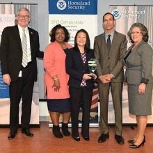 Susie Sylvester, CEO and Sanjeev Duggal, CTO accept Dev Technology’s DHS Small Business Achievement Award from Russell Deyo, DHS Under Secretary of Management; Janice Hill, CBP Director, Mission Support Acquisition; and Soraya Correa, DHS Chief Procurement Officer on April 21, 2016