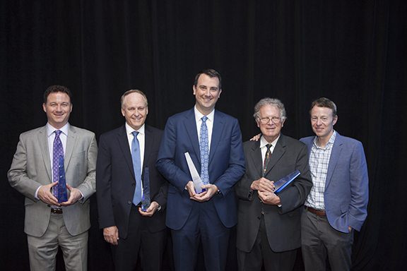 The 2016 Greater Washington CFO Award winners stand with their awards. From left: Kevin Boyce of Ellucian, Pat McCoy of ScienceLogic, David Keffer of CSRA, John May of New Vantage Group and Harry Weller of NEA. Photo credit NVTC.