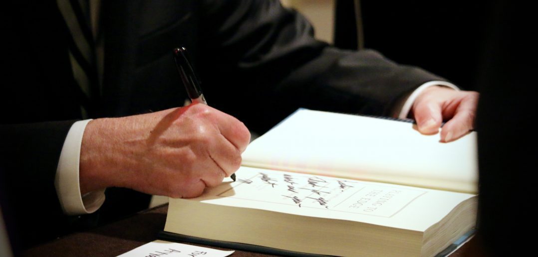 Photo of General Michael V Hayden Signing His Book, Playing to The Edge, at a WashingtonExec Event