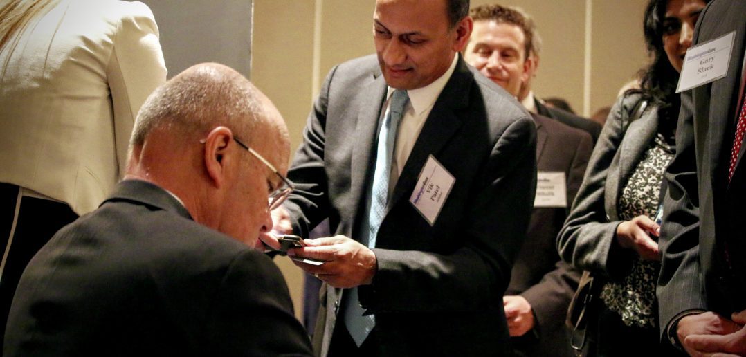 Photo of General Michael V Hayden Signing His Book, Playing to The Edge, at a WashingtonExec Event