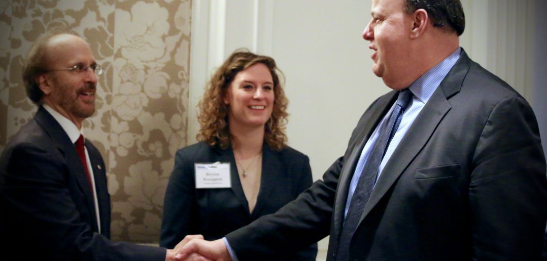 Photo of Greg Baroni and Sid Fuchs Shaking Hands at a WashingtonExec Event