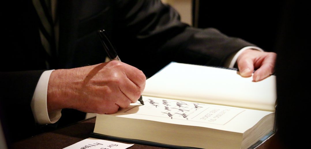 Photo of General Michael V Hayden Signing His Book, Playing to The Edge, at a WashingtonExec Event