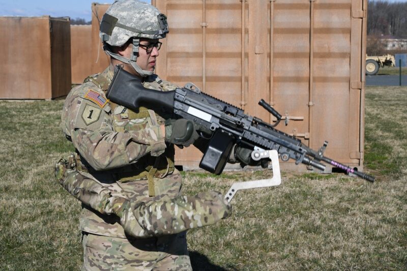 Army Sgt. Michael Zamora uses a prototype Third Army exoskeleton to easily aim an 18-pound M249 light machine gun during testing at Aberdeen Proving Ground, Maryland, March 18. 2017. U.S. Army photo: Conrad Johnson
