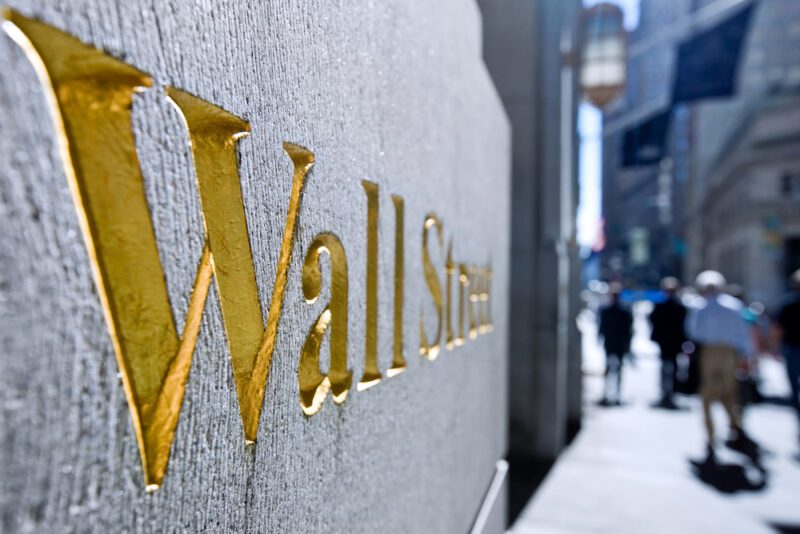 golden Wall Street sign in the downtown financial district of New York, USA